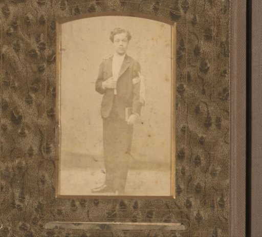 Portrait of a boy with a communion ribbon on his arm