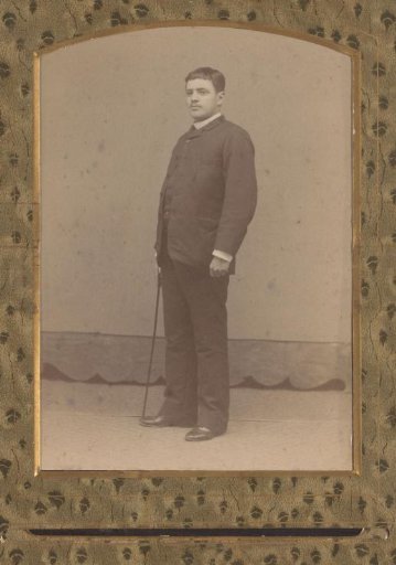 Portrait of a man with a walking stick
