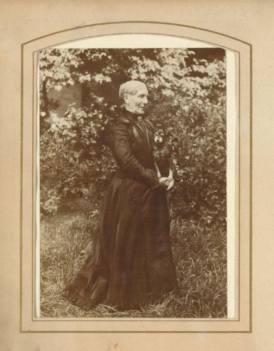 Portrait of a Woman with a Dog in a Garden