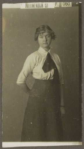 Portrait of a woman in a light blouse, skirt, and neckerchief