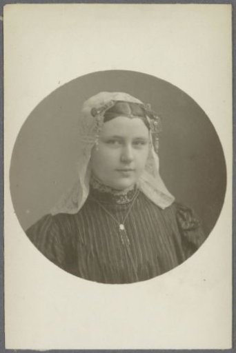 Portrait of a woman in traditional dress with a lace cap