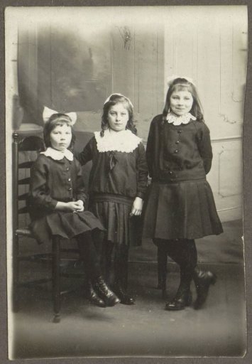 Group portrait of three girls, possibly sisters