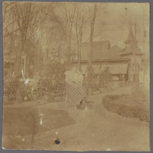 Portrait of a woman in a checkered skirt on a terrace