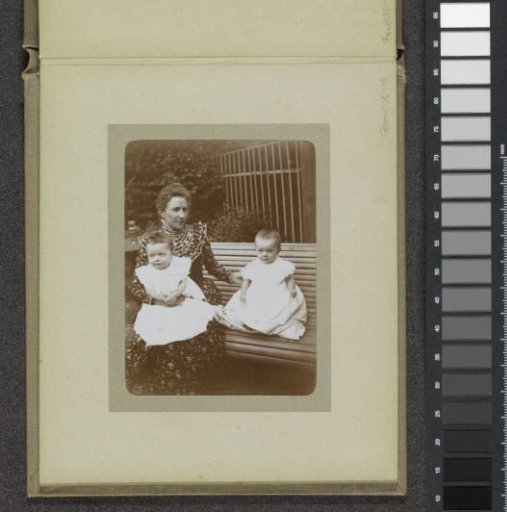 Woman with two toddlers by a bench, probably the twins Ad and Johanna van der Kop and a family member