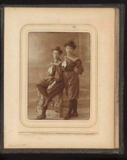 Studio portrait of two girls in sailor suits