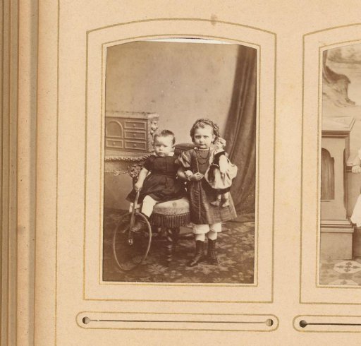 Portrait of a Seated Toddler with a Hoop and a Standing Girl with a Doll