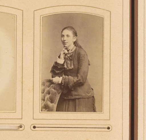Portrait of a girl leaning on the back of a chair