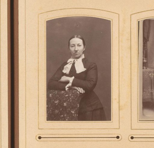 Portrait of a standing woman leaning on the back of a chair
