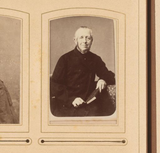 Portrait of a seated man with a book in his hand