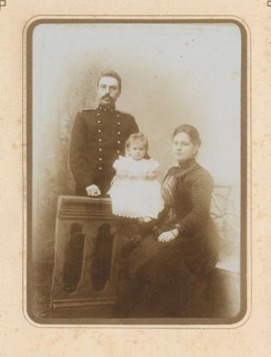 Portrait of a man in uniform and a woman and child