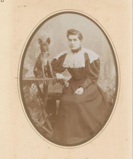 Portrait of a seated woman and a dog