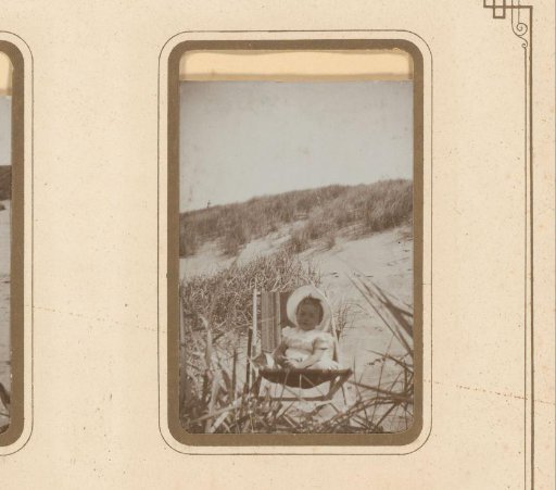 Toddler in a chair on the beach