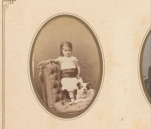 Portrait of a girl and dog on an armchair