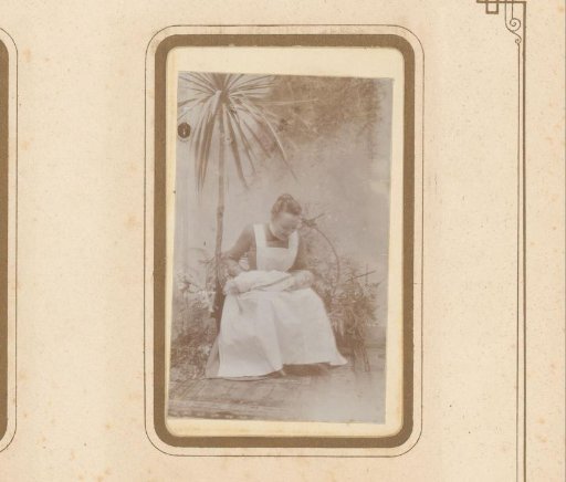Portrait of a maid with a baby on her lap