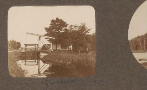 Canal with a bridge near a house at 's-Graveland