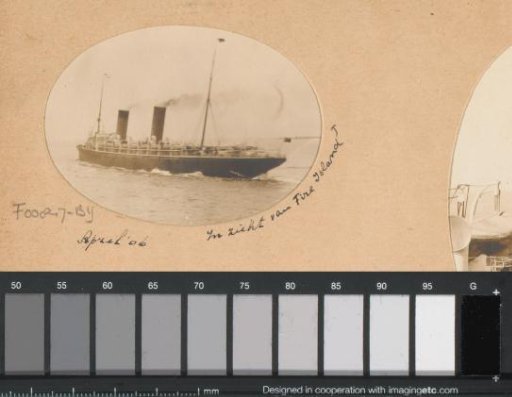 Ship with smoking funnels sailing off Fire Island near New York