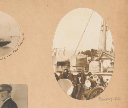 View of the deck of a ship with passengers, winches, and lifeboats