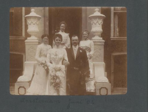 Portrait of a bride and groom with guests in Amsterdam