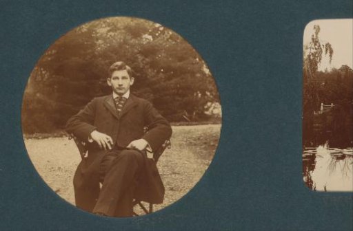 Portrait of a young man, sitting outdoors, probably in the Netherlands