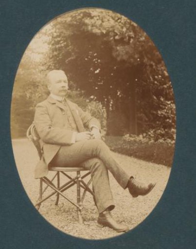 Portrait of a man, sitting outdoors, probably in the Netherlands