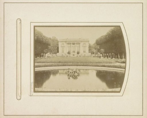 View of the Petit Trianon with a garden with a pond in the foreground in Versailles