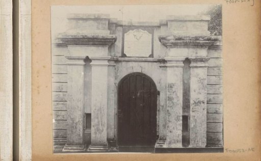 Dilapidated gate building with facade stone of a fort on Ambon