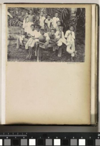 Laughing children with flute, ball and bicycle pump on Ambon