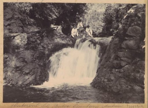 Men at a waterfall near Batoe Gantong on Ambon
