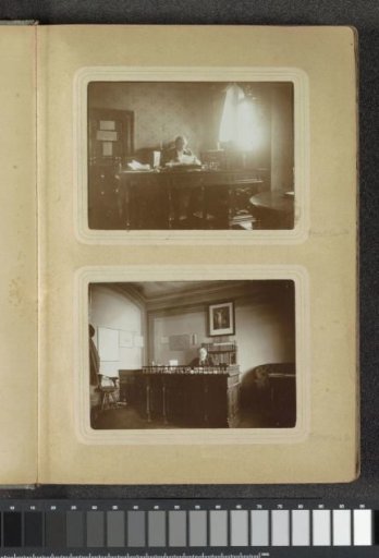 Portrait of a man reading behind a desk in a room in Germany
