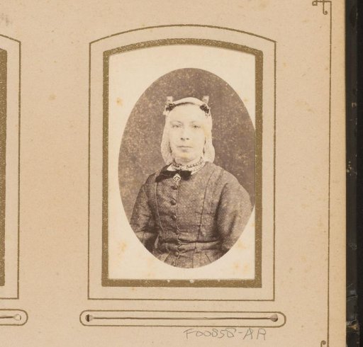 Portrait of a woman wearing a cap resembling a Frisian cap