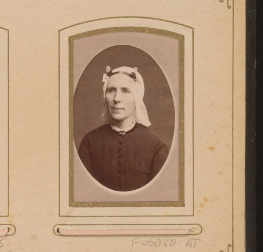 Portrait of a woman wearing a cap resembling a Frisian cap