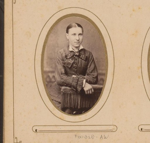 Portrait of a young woman leaning on a chair