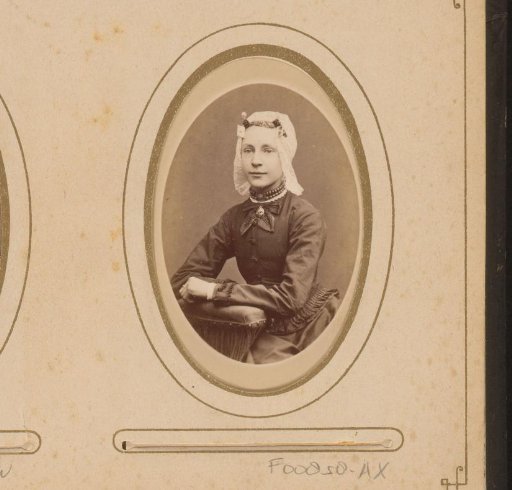 Portrait of a young woman wearing a cap resembling a Frisian cap