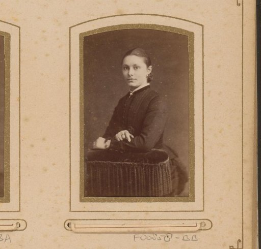 Portrait of a young woman leaning on a chair