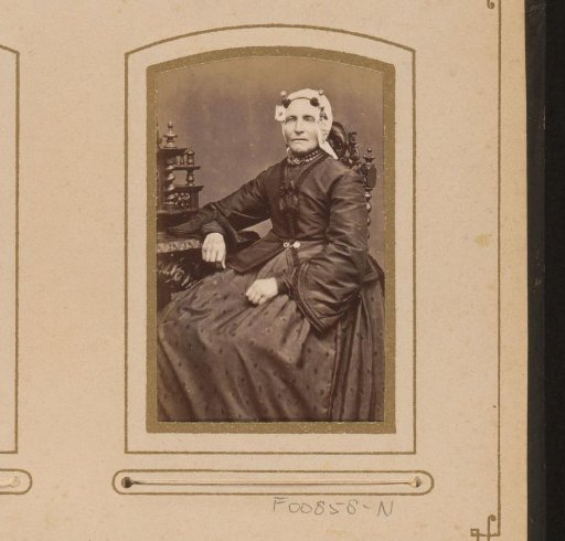 Portrait of a seated woman with a cap resembling a Frisian cap