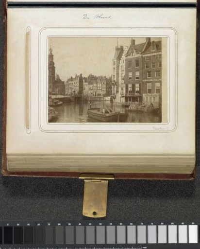 View of the Munttoren with covered barges on the Amstel in the foreground
