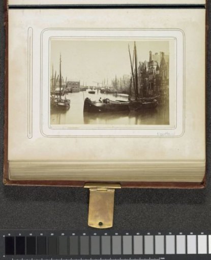 View of the Damrak in a northerly direction with a ferry boat in the foreground