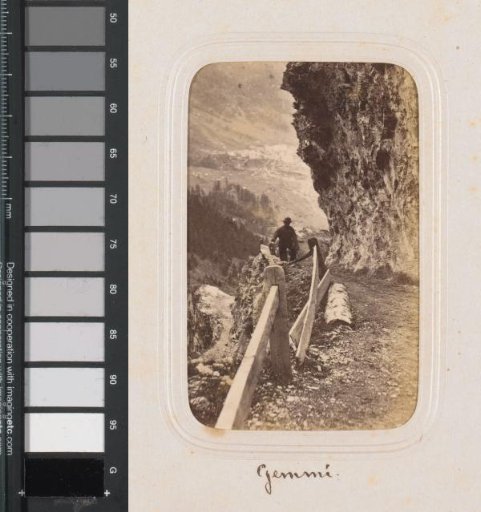Hiker on a Path on the Gemmi Mountain in the Valais
