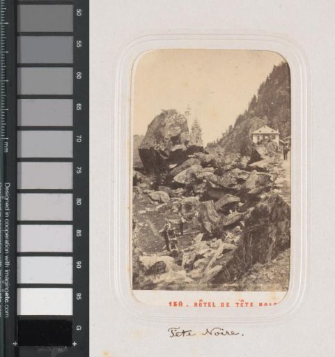 Men on a path at the Tête Noire in the Valais, with a hotel in the background