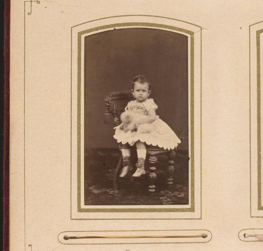 Portrait of a toddler, sitting on a chair