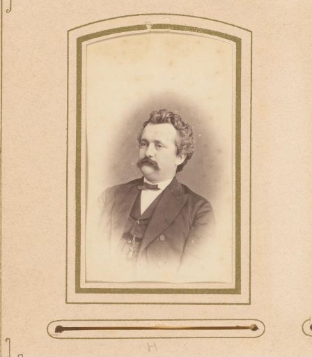 Portrait of a man with a mustache and bow tie
