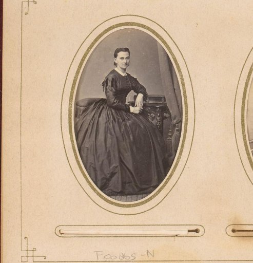 Portrait of a woman, leaning on a book