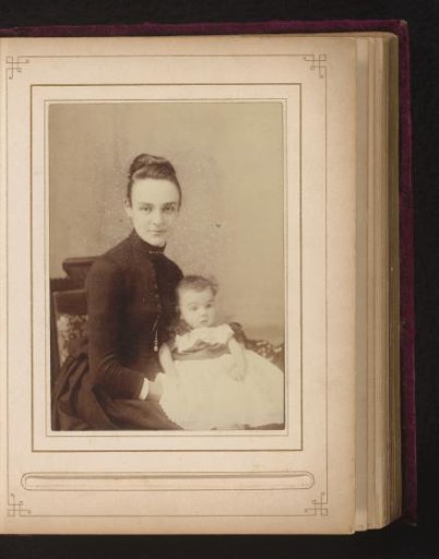 Portrait of a seated woman with a baby on her lap