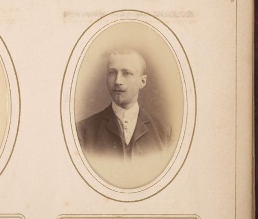 Portrait of a man with a mustache and sideburns