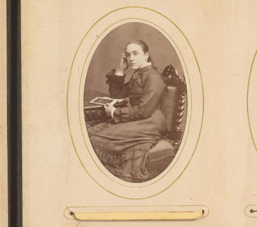 Portrait of a Girl Sitting at a Table with an Open Book