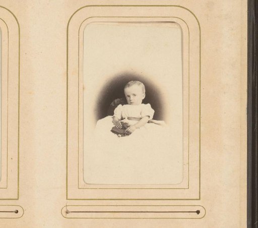 Portrait of a seated child in christening gown