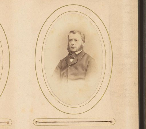 Portrait of a seated man with sideburns