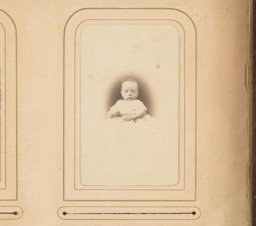 Portrait of a baby in a christening gown