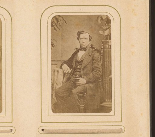 Portrait of a seated man with a beard