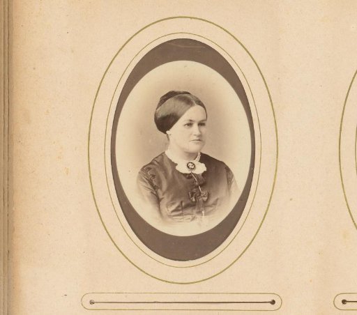 Portrait of a woman with a necklace with a medallion